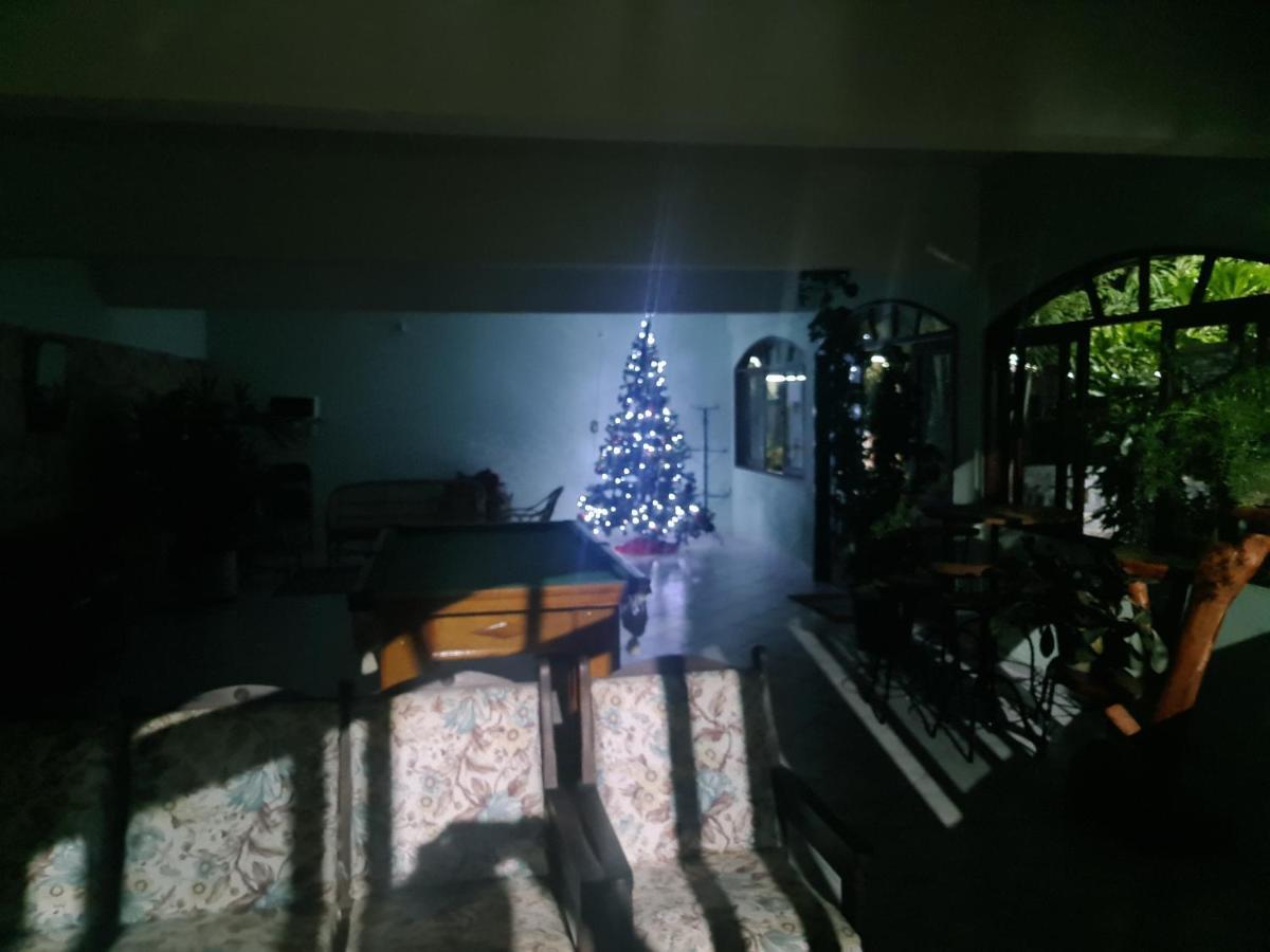 Pousada Nossa Senhora Пенеду Экстерьер фото A Christmas tree in a house in the Philippines