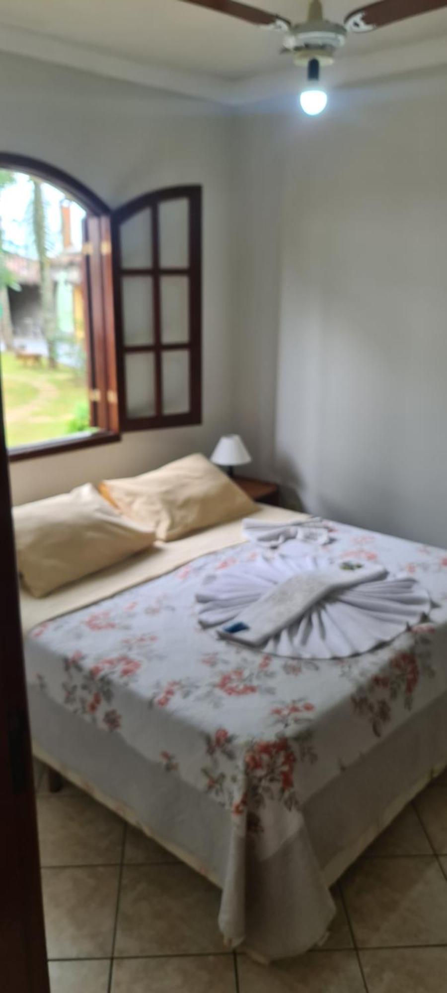 Pousada Nossa Senhora Пенеду Номер фото A bed with a bathrobe